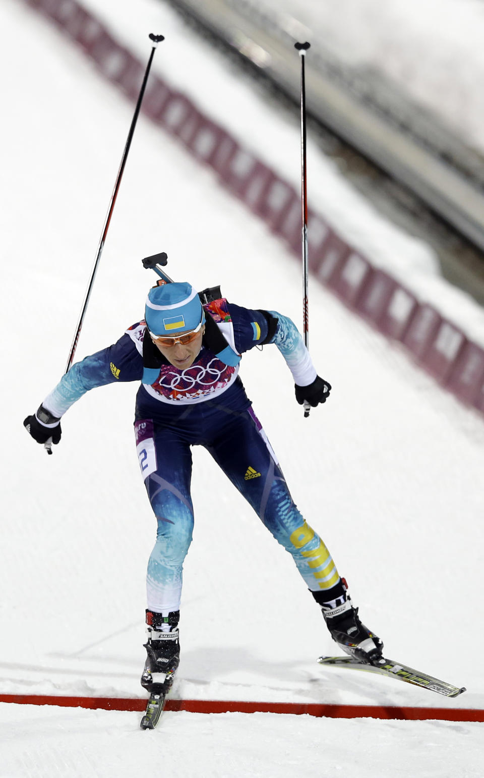 Ukraine's Vita Semerenko crosses the finish line to win the bronze medal the women's biathlon 7.5k sprint, at the 2014 Winter Olympics, Sunday, Feb. 9, 2014, in Krasnaya Polyana, Russia. (AP Photo/Kirsty Wigglesworth)