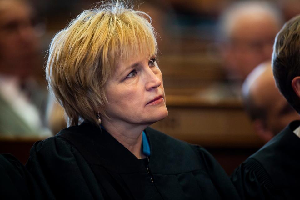 Justice Susan Christensen watches as Acting Chief Justice David Wiggins delivers the Condition of the Judiciary at the Iowa State Capitol on Wednesday, Jan. 15, 2020, in Des Moines.