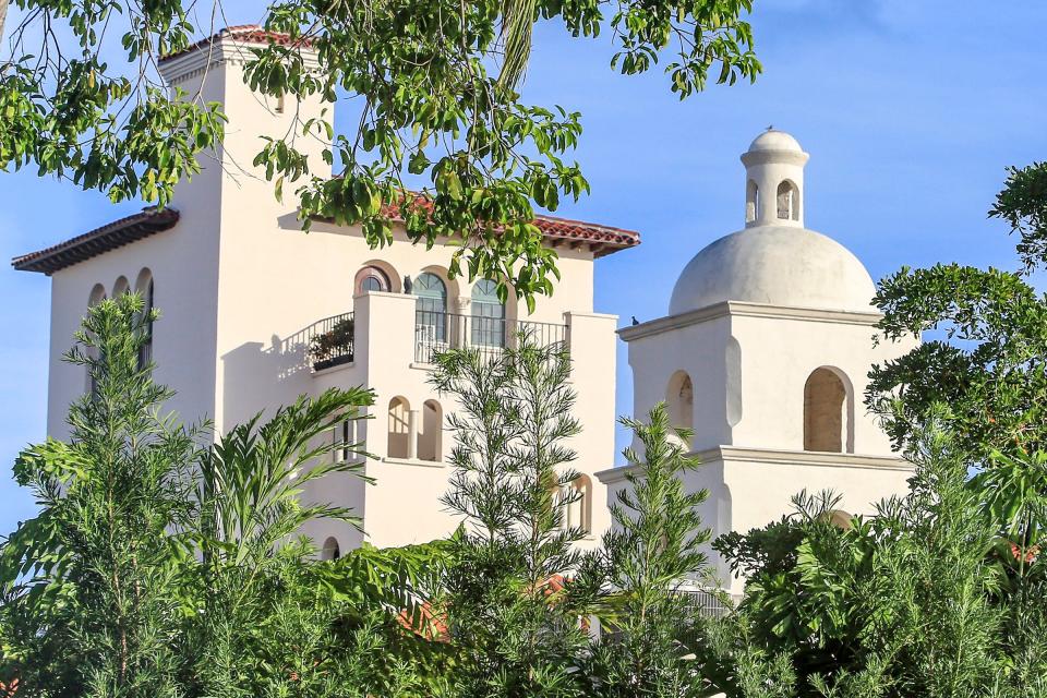 An Italian quattrocento tower and a 19th-century Santa Barbara Mission-style bell tower were among the eclectic architectural elements Mizner chose for the building that became the Everglades Club.