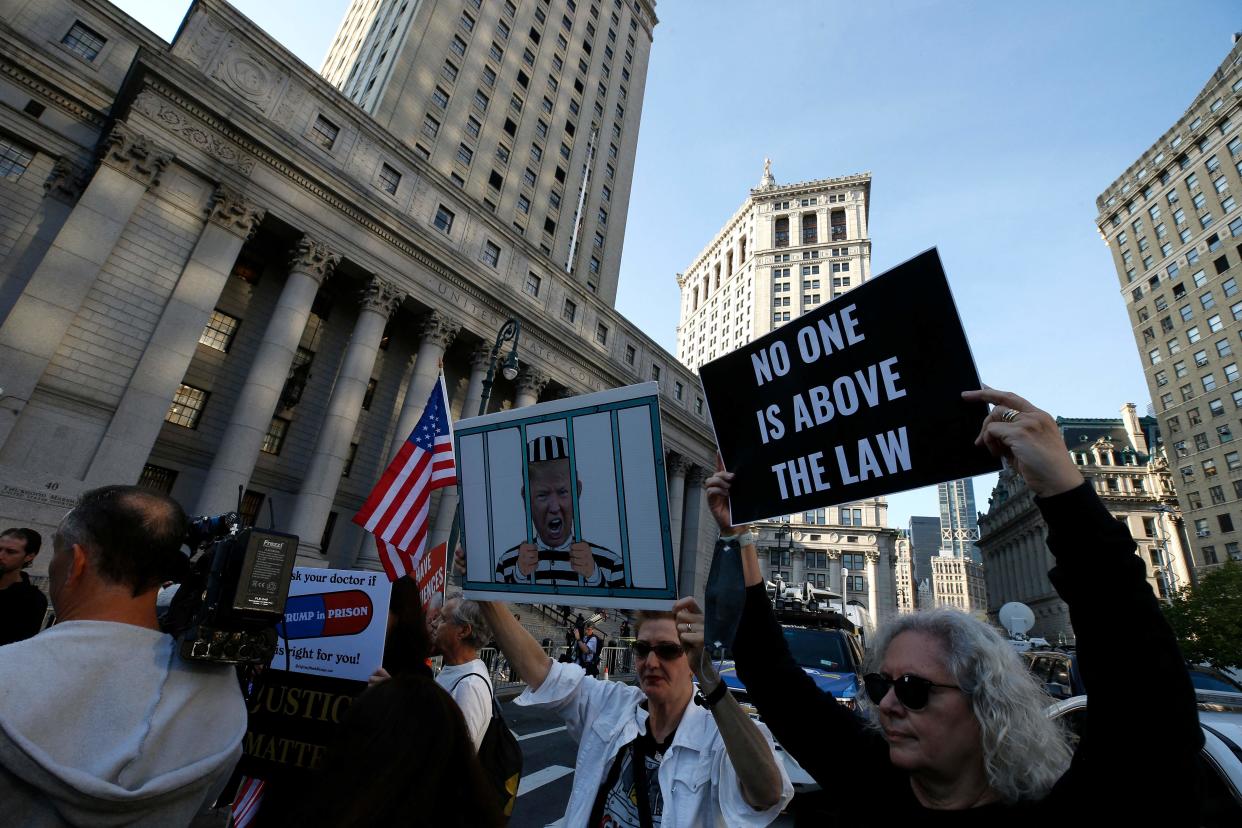 Demonstrators block traffic on the first day of the Trump financial fraud trial at the New York County Court House on October 2, 2023 in New York City. (AFP via Getty Images)