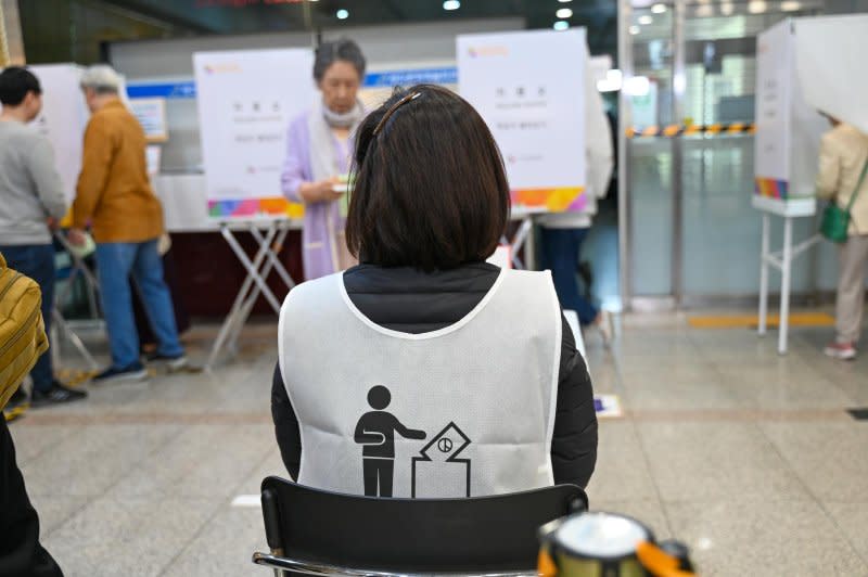 A poll watcher works at a polling station in Seoul Wednesday. Photo by Thomas Maresca/UPI