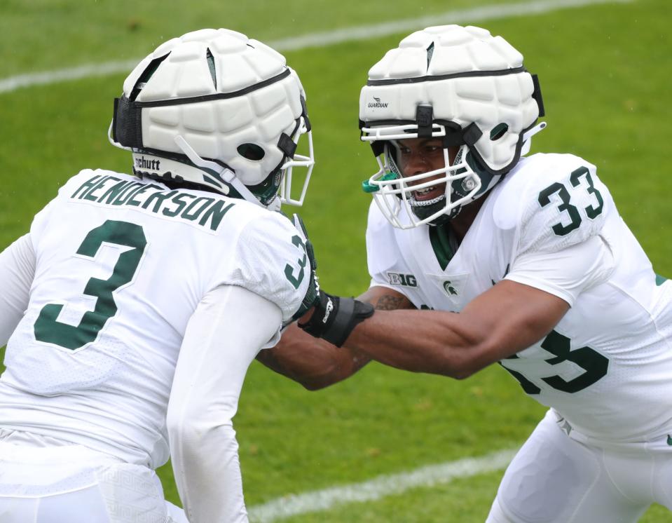 Michigan State defensive backs Xavier Henderson (3) and Kendell Brooks go through drills during the spring game Saturday, April 24, 2021 at Spartan Stadium in East Lansing.