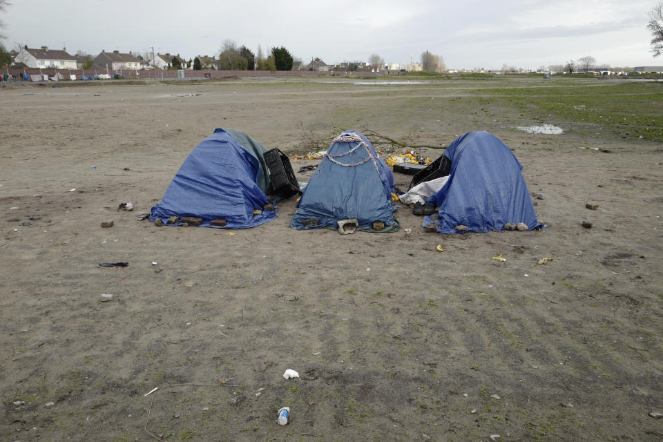 Tents are set up in a makeshift camp outside Calais, northern France, Saturday, Nov. 27, 2021. At the makeshift camps outside Calais, migrants are digging in, waiting for the chance to make a dash across the English Channel despite the news that at least 27 people died this week when their boat sank a few miles from the French coast. (AP Photo/Rafael Yaghobzadeh)