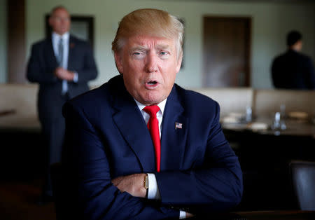 Republican U.S. presidential nominee Donald Trump sits for an interview at Trump National Doral golf club in Miami, Florida, U.S. October 25, 2016. REUTERS/Jonathan Ernst