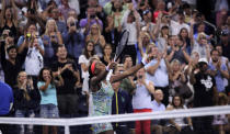 Fans cheer as Coco Gauff, of the United States, celebrates after defeating Timea Babos, of Hungary, during the second round of the U.S. Open tennis tournament in New York, Thursday, Aug. 29, 2019. (AP Photo/Charles Krupa)