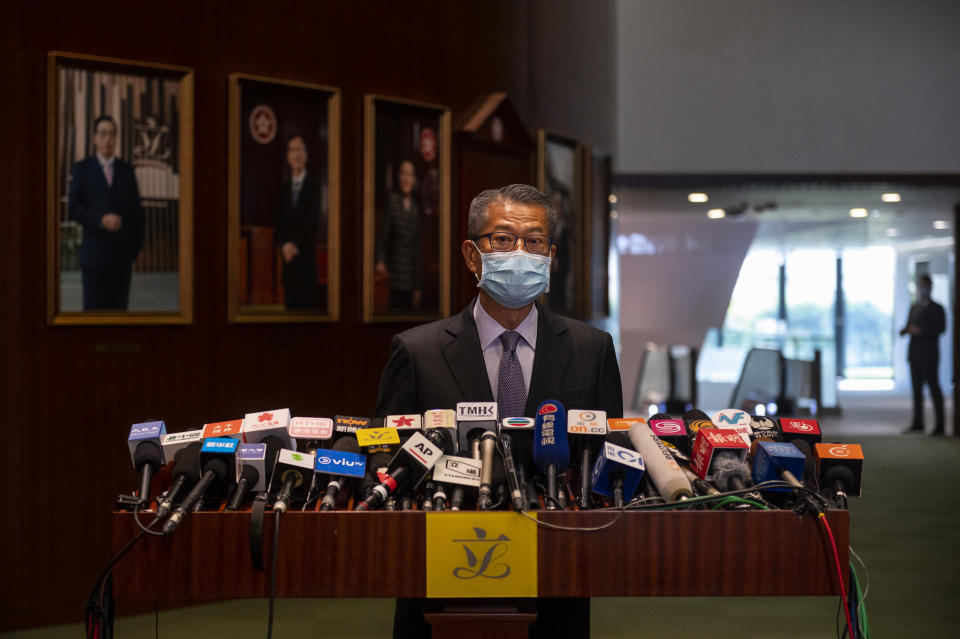 HONG KONG, CHINA - NOVEMBER 25: Hong Kong Financial Secretary, Paul Chan Mo-po, speaks to the press during a news conference moments after Chief Executive Carrie Lam has delivered the annual policy address at the Legislative Council building on November 25, 2020, in Hong Kong, China. Lam delivers her economic policy address Wednesday after weeks of delay, mass resignation from pro-democracy democrats lawmakers and new steps to boost economic links with China. (Photo by Miguel Candela/Anadolu Agency via Getty Images)