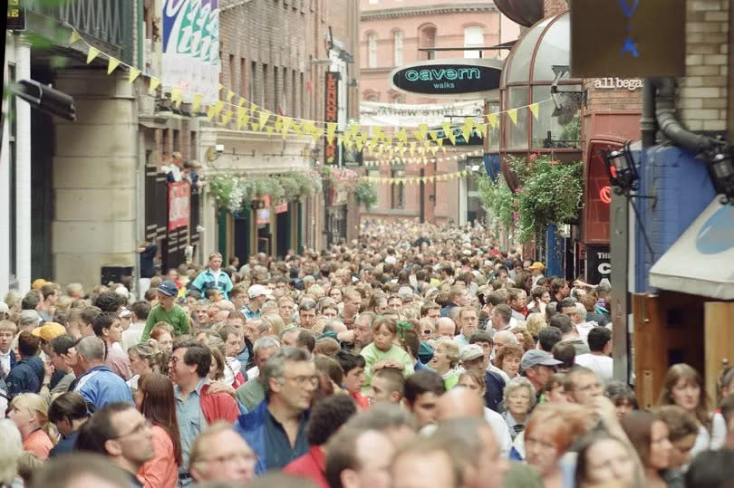 Scenes from The Beatles Weekend. Liverpool, Merseyside.

Fans enjoy a weekend of music, dancing, exhibitions, and socialising, as once again the city
celebrates the music of The Beatles.

Picture shows the crowds of people filling up Mathew Street where The Cavern Club was, and still is.

Picture taken 31st August 1993.