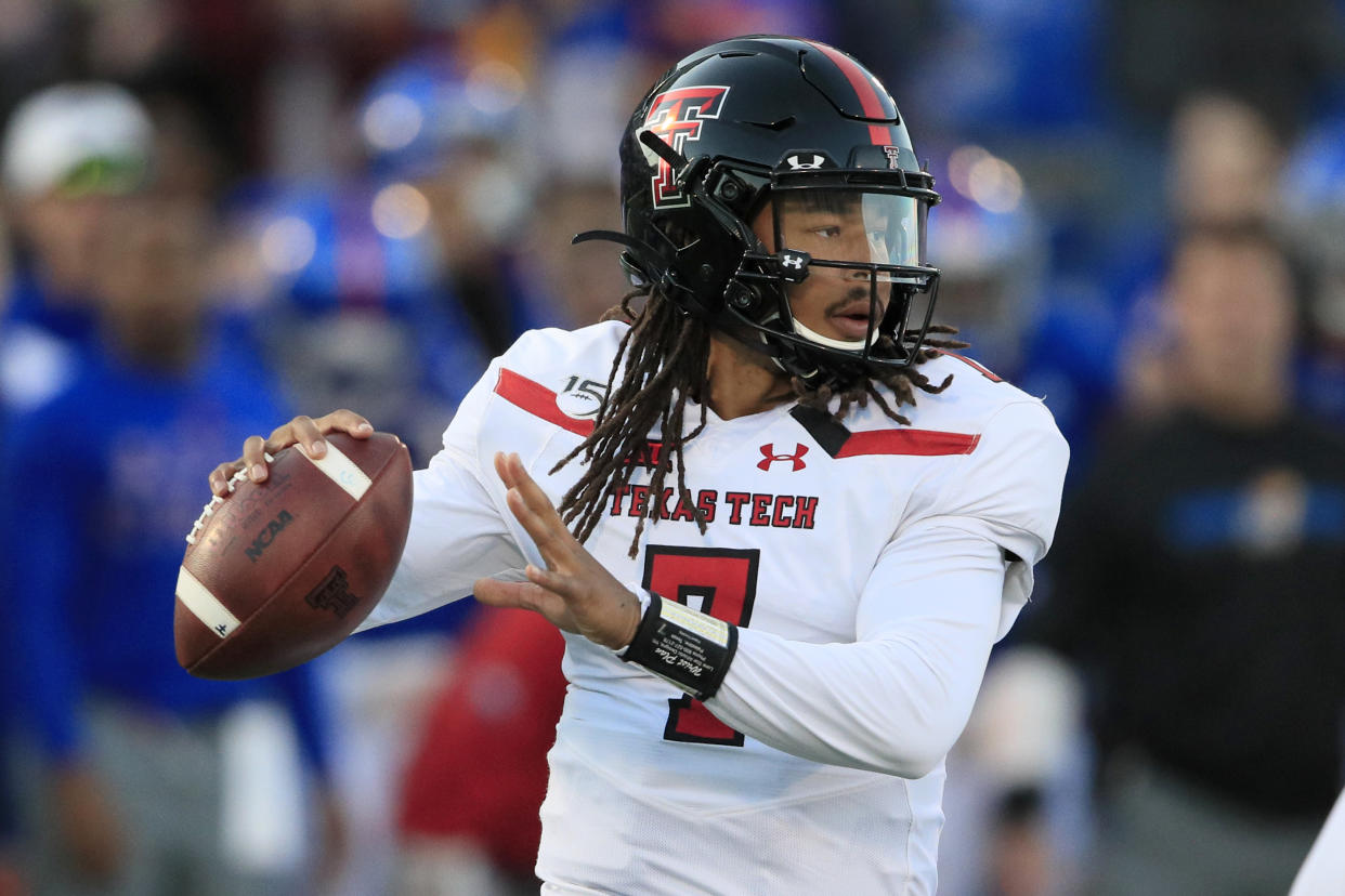 Texas Tech quarterback Jett Duffey passes to a teammate during the first half of an NCAA college football game against Kansas in Lawrence, Kan., Saturday, Oct. 26, 2019. (AP Photo/Orlin Wagner)