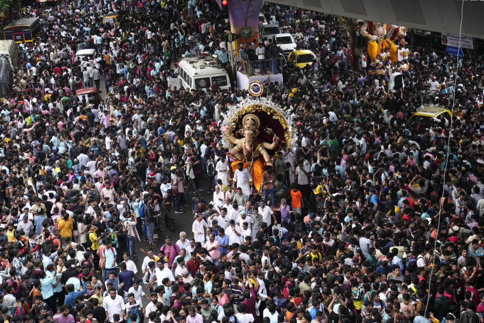 FILE - An idol of the elephant-headed Hindu god Ganesha is carried to a place of worship, ahead of the Ganesh Chaturthi festival in Mumbai, India, Saturday, September 9, 2023. The nones in India come from an array of belief backgrounds, including Hindu, Muslim and Sikh. The surge of Hindu nationalism has shrunk the space for the nones over the last decade, activists say. (AP Photo/Rajanish Kakade, File)