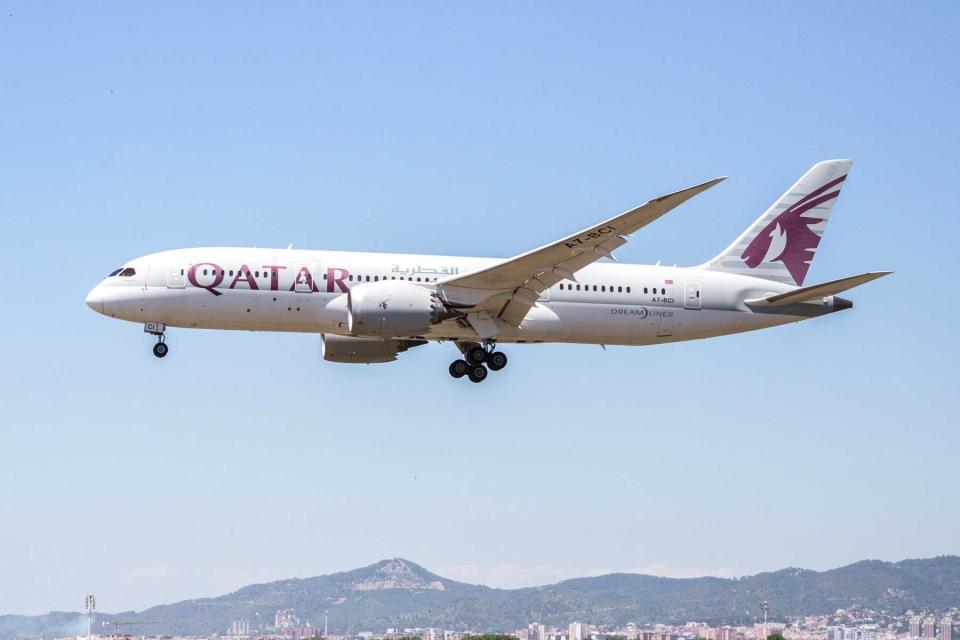 A Qatar airlines plane landing at El Prat airport in Spain