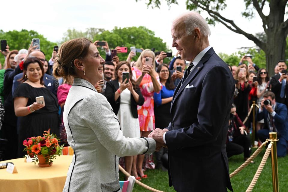 US President Joe Biden (R) greets Mexican First Lady Beatriz Gutierrez Mueller de Lopez Obrador (L) during a Cinco de Mayo reception at the Rose Garden of the White House in Washington, DC on May 5, 2022. (Photo by SAUL LOEB / AFP) (Photo by SAUL LOEB/AFP via Getty Images) ORG XMIT: 0 ORIG FILE ID: AFP_329J9H6.jpg