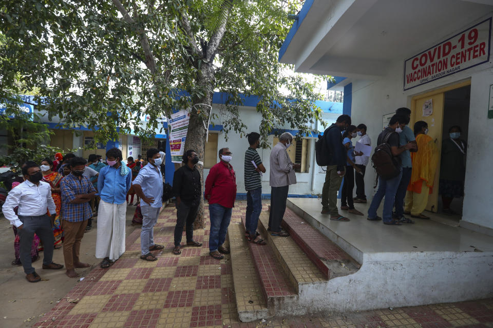 People line up to register their names to receive COVID-19 vaccine in Hyderabad, India, Thursday, Dec. 2, 2021. (AP Photo/Mahesh Kumar A.)