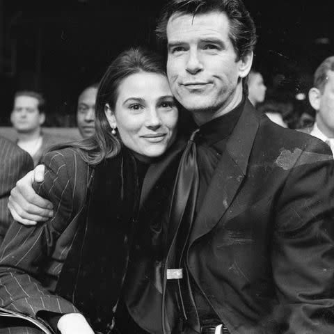 <p>Independent News And Media/Getty</p> Keely Shaye Smith and Pierce Brosnan in 1995