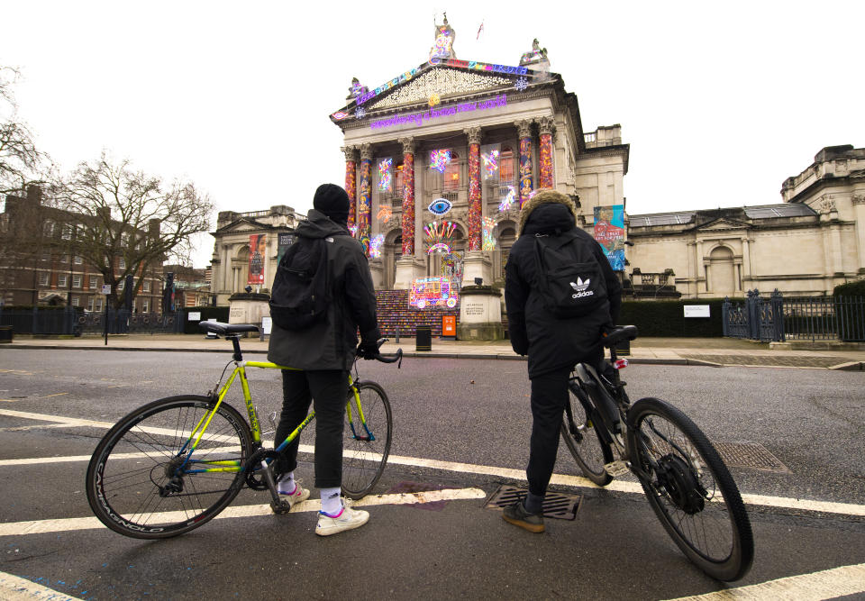 Two people view 'Remembering a Brave New World' by Chila Kumari Singh Burman, outside Tate Britain in London during England's third national lockdown to curb the spread of coronavirus. Picture date: Monday February 1, 2021. (Photo by Ian West/PA Images via Getty Images)