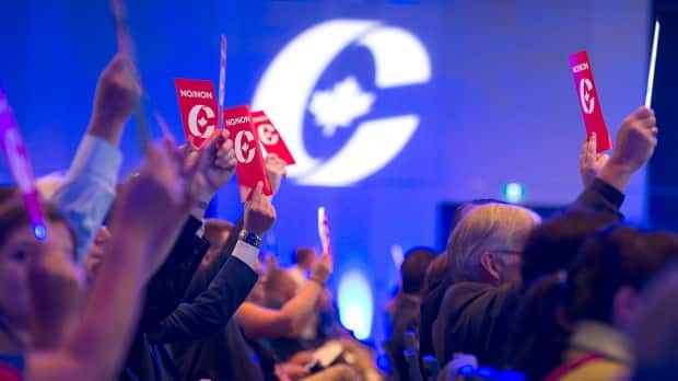 Delegates vote on party constitution items at a Conservative Party of Canada national policy convention.