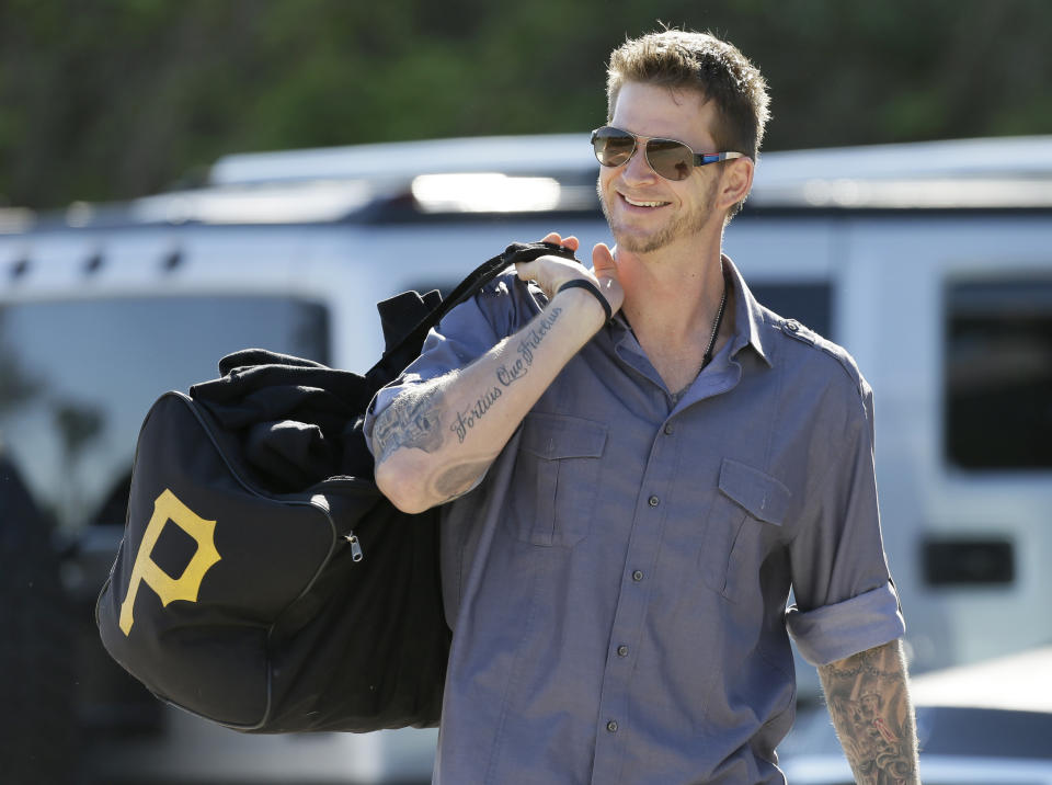 Philadelphia Phillies pitcher A.J. Burnett arrives at Bright House Field before a spring training baseball practice Sunday, Feb. 16, 2014, in Clearwater, Fla. (AP Photo/Charlie Neibergall)