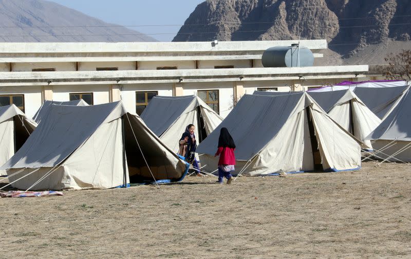 FILE PHOTO: Children, play outside the tents, setup amid fear of coronavirus, to quarantine people who crossed from Iran border post Taftan, on the outskirts of Quetta