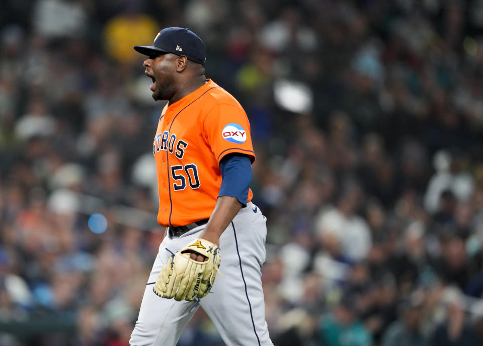 Houston Astros relief pitcher Hector Neris yells after striking out Seattle Mariners' Julio Rodriguez to end the sixth inning of a baseball game Wednesday, Sept. 27, 2023, in Seattle. (AP Photo/Lindsey Wasson)