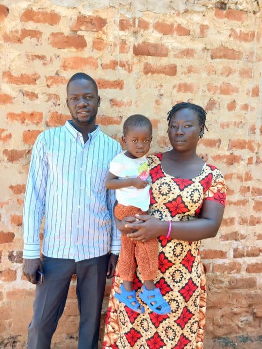 Two-year-old Aaron from Uganda, pictured with his parents. (Courtesy HeartGift Foundation)