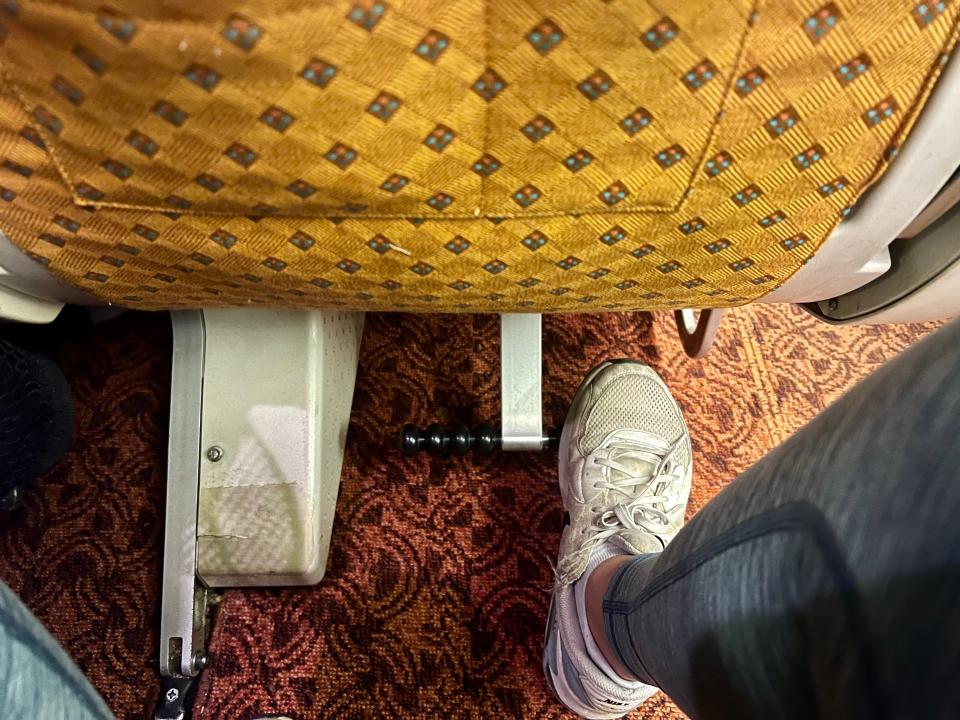 The author's tennis shoe on the footrest.