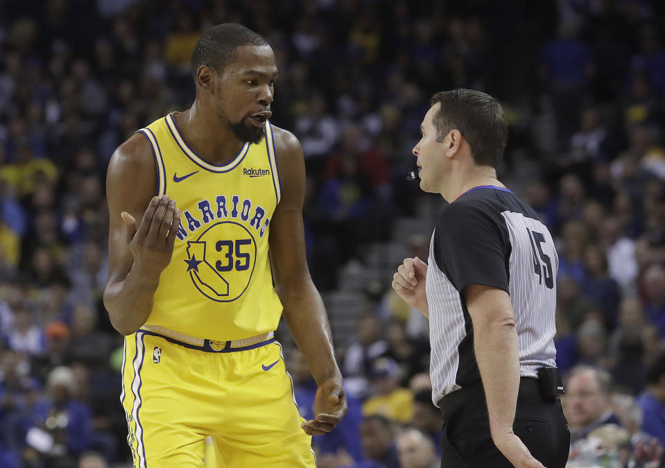 Golden State Warriors forward Kevin Durant (35) talks with referee Brian Forte during the first half of an NBA basketball game between the Warriors and the Phoenix Suns in Oakland, Calif., Sunday, March 10, 2019. (AP Photo/Jeff Chiu)