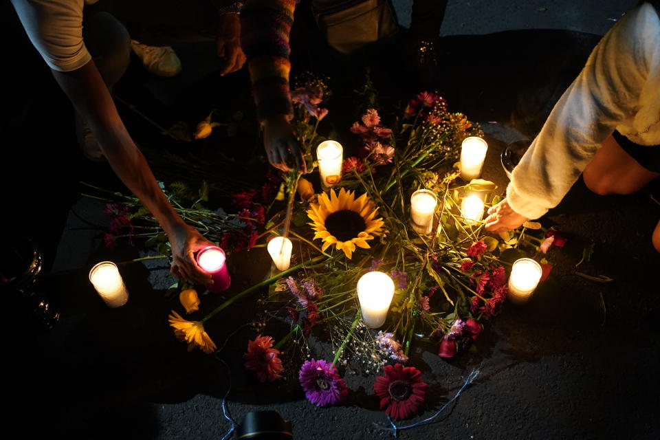 Locals light candles during a national protest against the murder of journalists Lourdes Maldonado and freelance photojournalist Margarito Martínez, in Mexico City, Tuesday, Jan. 25, 2022. Mexico's Interior Undersecretary Alejandro Encinas said recently that more than 90% of murders of journalists and rights defenders remain unresolved, despite a government system meant to protect them. (AP Photo/Eduardo Verdugo)