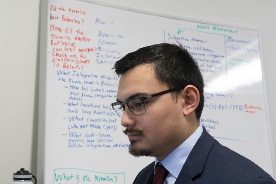 George Barros, a Geospatial Analyst on the Russia Team, works at his desk at the Institute for the Study of War, Wednesday, Jan. 11, 2023, in Washington. (AP Photo/Alex Brandon)