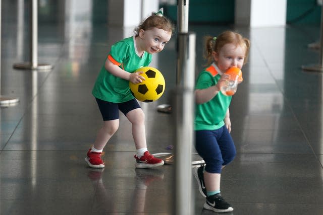 Republic of Ireland supporters Doireann Mulvaney, aged 3 (left) and Isla Reilly, age 2 from Co. Meath as the Republic of Ireland team depart from Dublin Airport to head to the 2023 FIFA Women’s World Cup in Australia and New Zealan