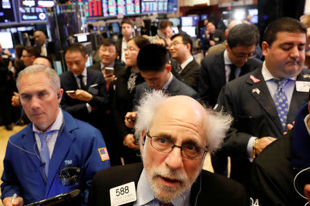 Traders work on the floor of the New York Stock Exchange (NYSE) in New York, U.S., February 8, 2018. REUTERS/Brendan McDermid