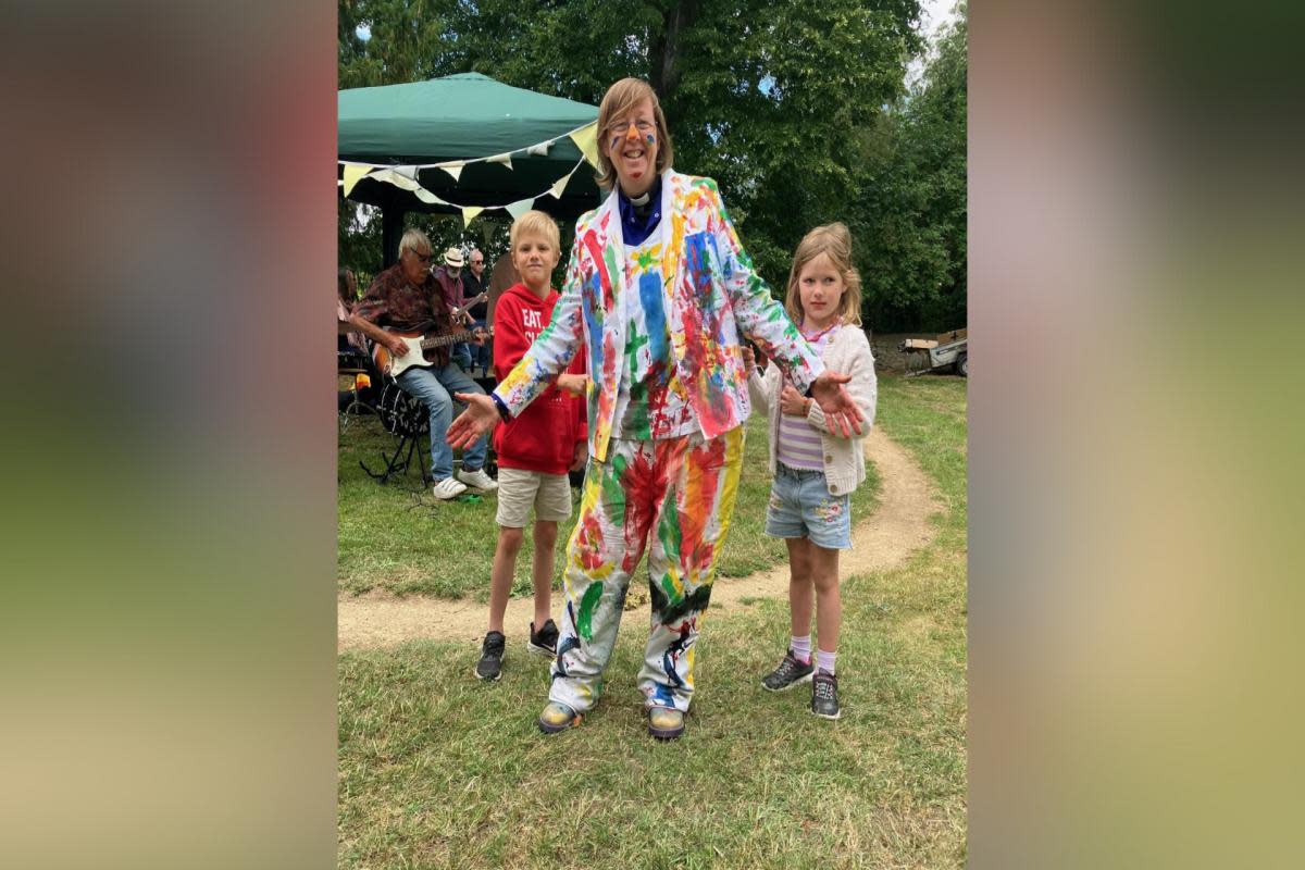 Rev Susy Brouard enjoyed the paint last year - pictured with Arthur Watson, 8, and his sister Maud, 6. <i>(Image: Kidlington Church Fete)</i>