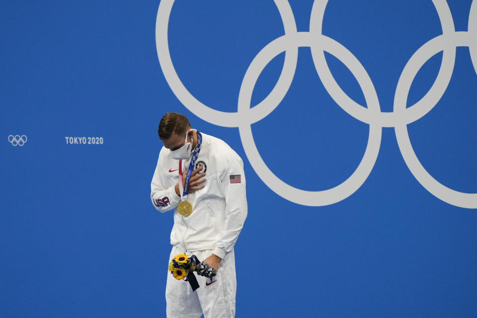 Caeleb Dressel, of the United States, celebrates his gold medal in the men's 4x100-meter medley relay final at the 2020 Summer Olympics, Sunday, Aug. 1, 2021, in Tokyo, Japan. (AP Photo/Jae C. Hong)