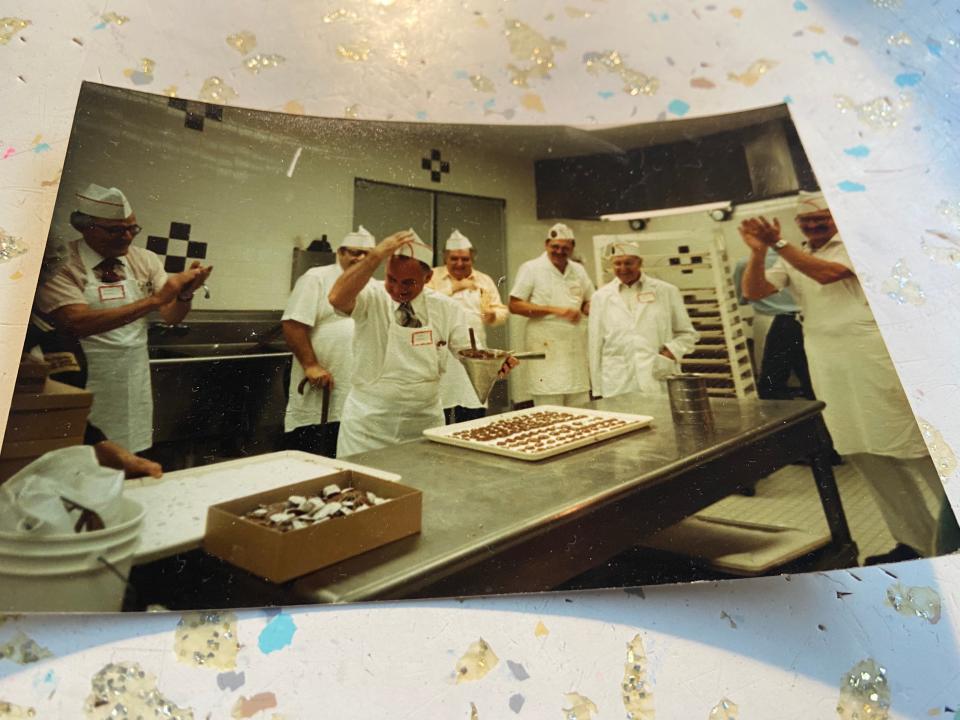 Evans Corden, standing with funnel, at a chocolate making class.