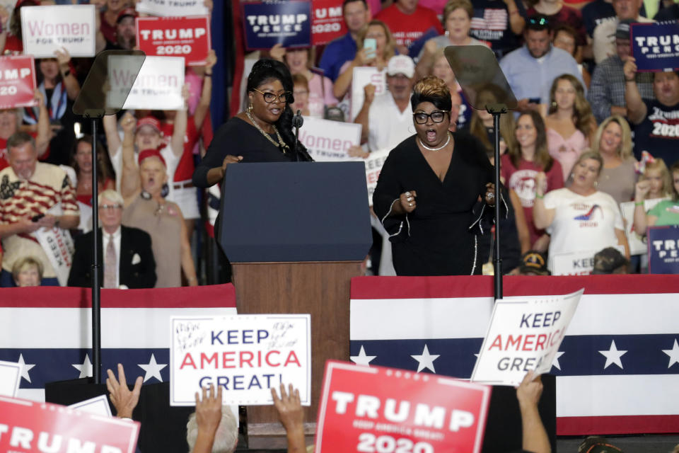 FILE - Diamond, left, and Silk take the podium at a rally before President Donald Trump speaks in Fayetteville, N.C., on Sept. 9, 2019. Lynette Hardaway, known by the moniker “Diamond” of the conservative political commentary duo "Diamond and Silk", has died, former President Donald Trump and the pair's official Twitter account announced Monday, Jan. 9, 2023. She was 51. (AP Photo/Chris Seward, File)