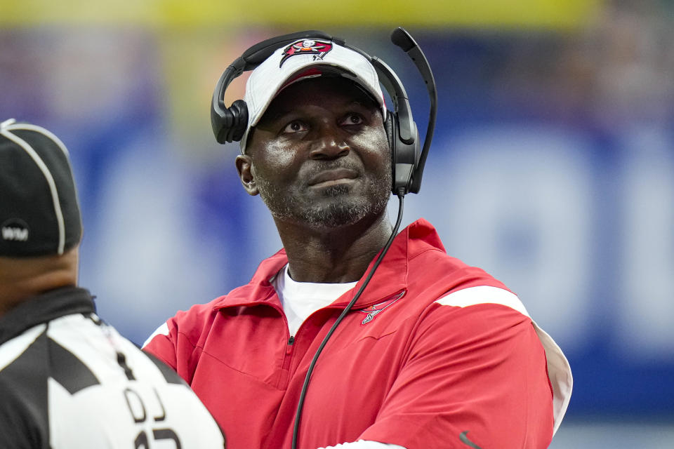 Tampa Bay Buccaneers head coach Todd Bowles checks the replay screen in the first half of an NFL preseason preseason football game against the Indianapolis Colts in Indianapolis, Saturday, Aug. 27, 2022. (AP Photo/AJ Mast)