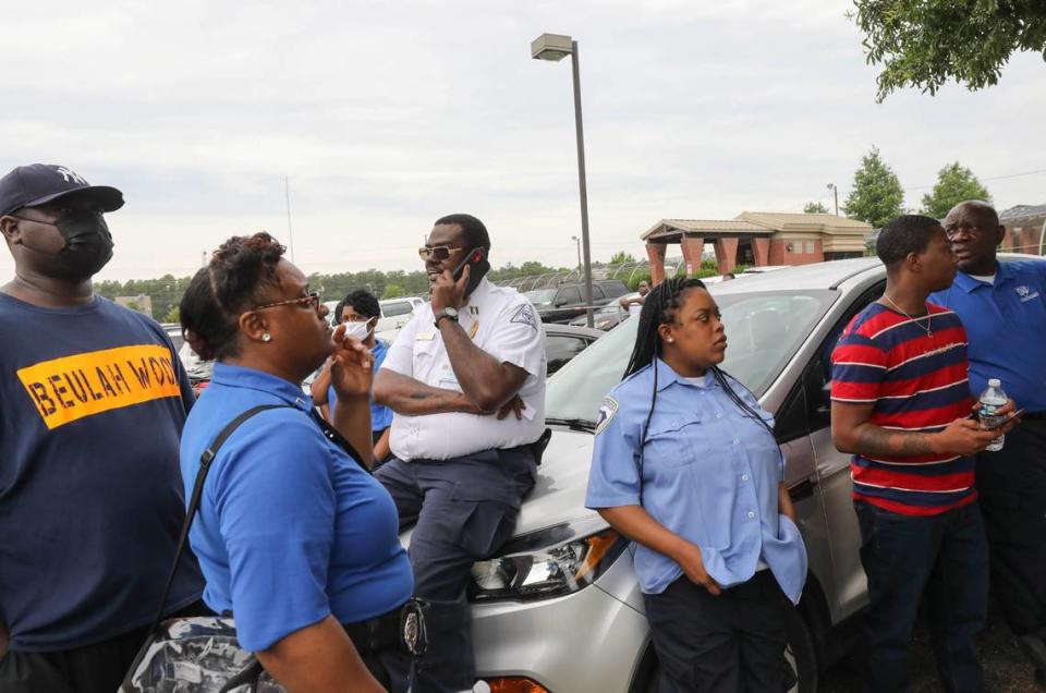 Corrections Officer Ricky Dyches, center on car, is joined by others who are protesting the working conditions at DJJ.
