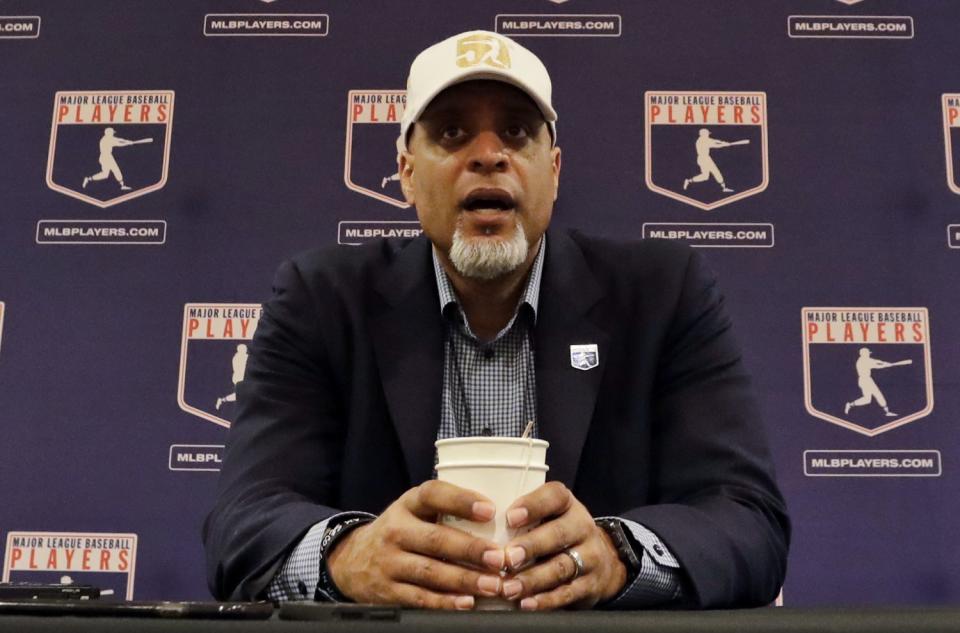 In this Feb. 19, 2017, photo, Tony Clark, MLBPA executive director, answers questions at a news conference in Phoenix.