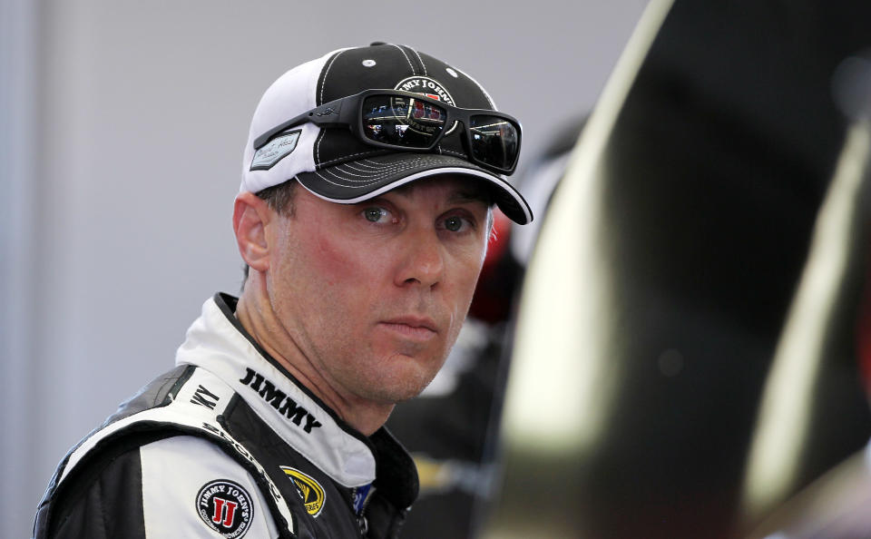 Kevin Harvick works in the garage during NASCAR Sprint Cup auto racing practice on Friday, March 7, 2014, in Las Vegas. (AP Photo/Isaac Brekken)