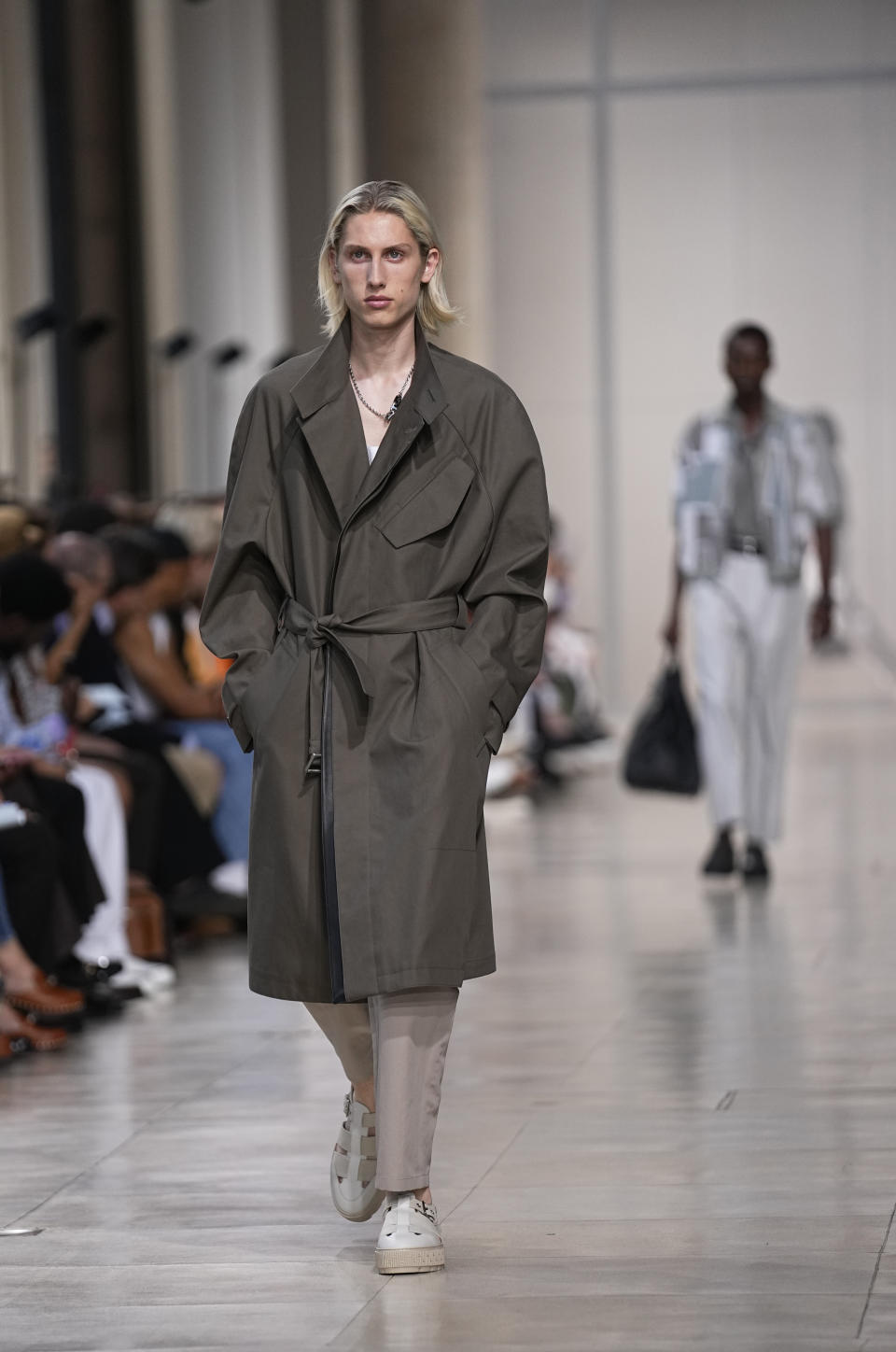 A model wears a creation for the Hermes Menswear Spring/Summer 2024 fashion collection presented in Paris, Saturday, June 24, 2023. (AP Photo/Michel Euler)