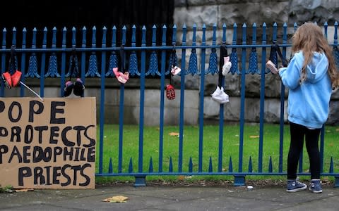 A protest placard in Dublin ahead of the Pope's visit to Ireland in August - Credit: Gonzalo Fuentes/Reuters