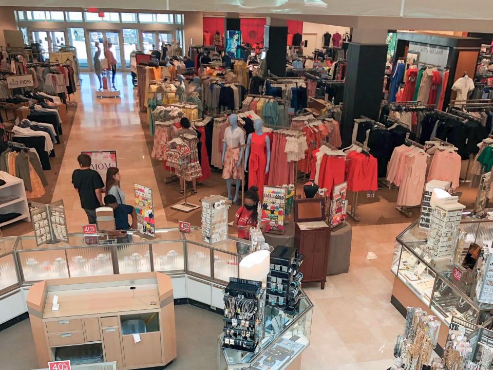 HOUSTON, May 5, 2020 -- Customers shop at a shopping mall in Frisco, on the outskirts of Dallas, Texas, the United States, May 5, 2020. After closed for several weeks due to the outbreak of COVID-19 pandemic, the shopping mall reopened with shortened business hours on Tuesday. (Photo by Dan Tian/Xinhua via Getty) (Xinhua/ via Getty Images)