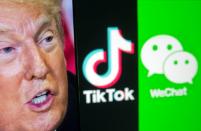 A picture of U.S. President Donald Trump is seen on a smartphone in front of displayed Tik Tok and WeChat logos in this illustration