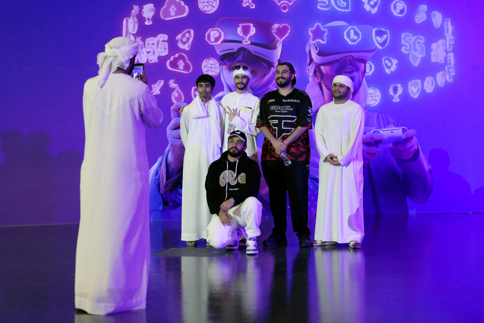 Gaming fans take photo during the Dubai Esports and Games Festival in Dubai, United Arab Emirates, Saturday, June 24, 2023. Saudi Arabia, the new home of some of soccer’s biggest stars and a co-owner of professional golf, is proving to be no less ambitious when it comes to another global pastime, the $180 billion-a-year video game industry. (AP Photo/Kamran Jebreili)