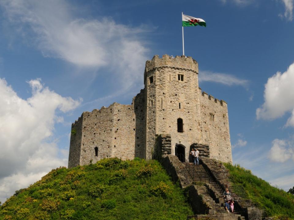 A Welsh flag atop the 11th-century Norman keep at Cardiff Castle (Getty/iStock)
