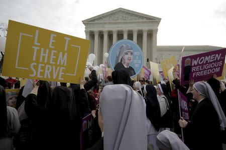 Nuns rally before Zubik v. Burwell, an appeal brought by Christian groups demanding full exemption from the requirement to provide insurance covering contraception under the Affordable Care Act, is heard by the U.S. Supreme Court in Washington, March 23, 2016. REUTERS/Joshua Roberts