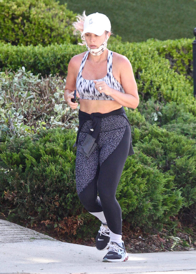 Kendall Jenner flashes sculpted abs in Alo Yoga sports bra and shorts