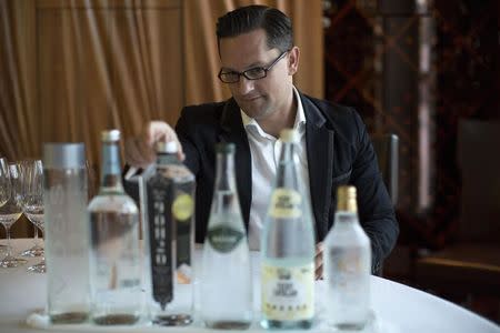 German water sommelier Martin Riese looks at bottles of water to be used in a water tasting class at Patina restaurant in Los Angeles, California February 25, 2015. REUTERS/Mario Anzuoni