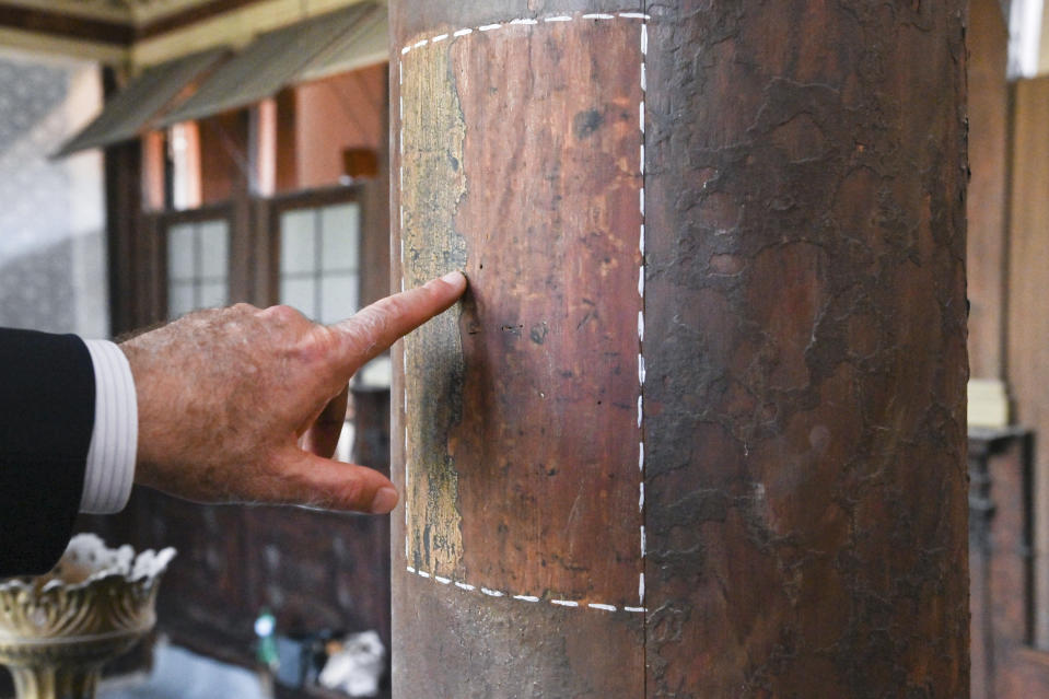 Art historian David Landau points out a restored area of a wooden column in the 1575 Italian Schola Synagogue in Venice, northern Italy, Wednesday, June 1, 2022. Landau is spearheading the fundraising effort to restore Venice's synagogues and nearby buildings both for Venice’s small Jewish community and for tourists who can visit them on a guided tour through the Jewish Museum of Venice. (AP Photo/Chris Warde-Jones)