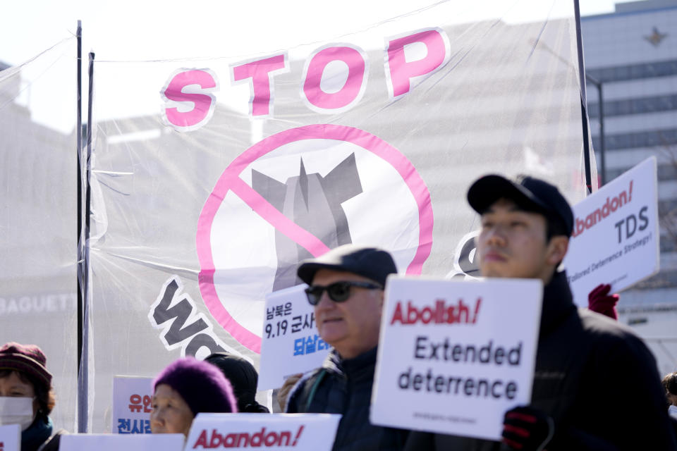 Protesters hold signs during a rally demanding to stop the joint military exercises between the U.S. and South Korea, in Seoul, South Korea, Monday, March 4, 2024. South Korea and the United States began large annual military exercises Monday to bolster their readiness against North Korean nuclear threats after the North raised animosities with an extension of missile tests and belligerent rhetoric earlier this year. (AP Photo/Lee Jin-man)