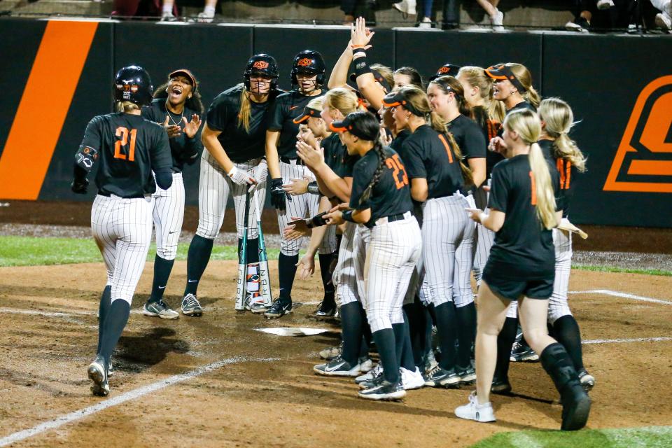 Oklahoma State's Haidyn Sokoloski (21) hits a home run during a pre-season softball game between Oklahoma State (OSU) and Tulsa (TU) at Cowgirl Stadium in Stillwater, Okla., on Thursday, Oct. 26, 2023.