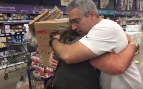 Pam Brekke hugs Ramon Santiago after he gave her his generator - Credit: FACEBOOK/NANCY ALVAREZ WFTV